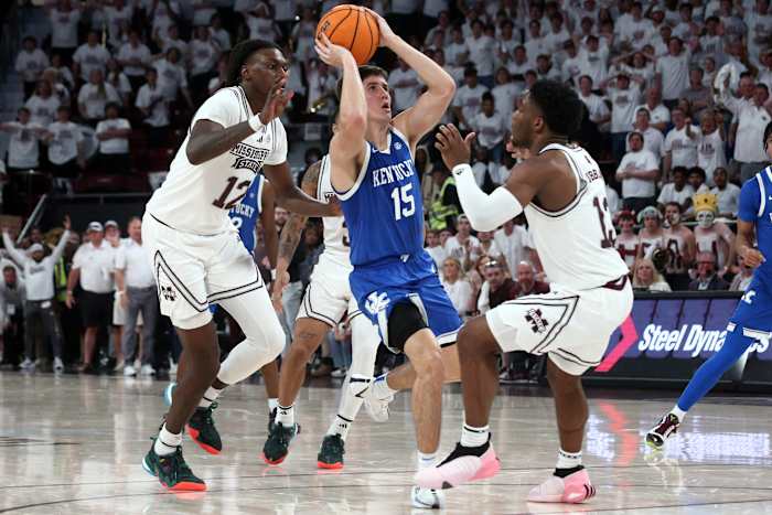 Feb 27, 2024; Starkville, Mississippi, USA; Kentucky Wildcats guard Reed Sheppard (15) scores on the final shot of the game as Mississippi State Bulldogs forward KeShawn Murphy (12) and guard Josh Hubbard (13) defend during the second half at Humphrey Coliseum. Mandatory Credit: Petre Thomas-USA TODAY Sports